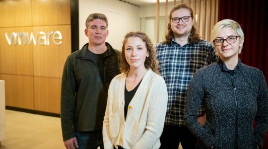 A group of Northeastern co-op students and alumni at VMWare|Genevieve Epstein (facing) and Liam Weldon|Liam Weldon|David Silvia|Sasha Rudyakov