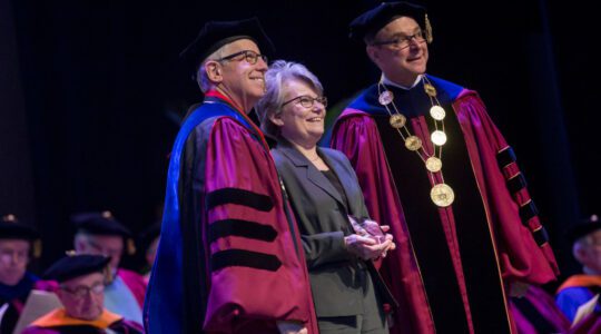 CCIS Associate Dean Doreen Hodgkin accepts the Outstanding Service Award from Northeastern President Joseph E. Aoun and Provost Stephen W. Director