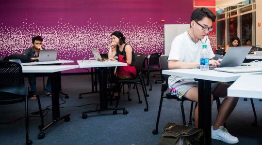 Students work in the new CCIS computer lab.