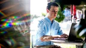 Masters student, Kyle Sferrazza, who studies cybersecurity, works on code outside the ISEC building on Wednesday, Oct. 6, 2021. The U.S. Department of Energy (DOE) CyberForce program held the second in its new competition series, Conquer the Hill, on September 18. Kyle Sferrazza of Northeastern University won the Reign Edition of Conquer the Hill, competing against 45 participants. Photo by Matthew Modoono/Northeastern University