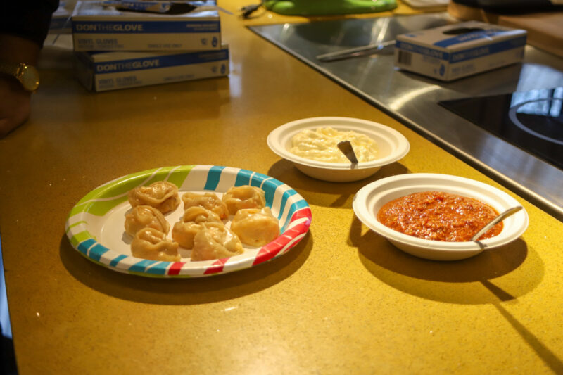 Indian dish served on paper plates in kitchen