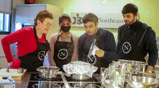 Dean Elizabeth Mynatt cooks with a student group during Giving Day 2022