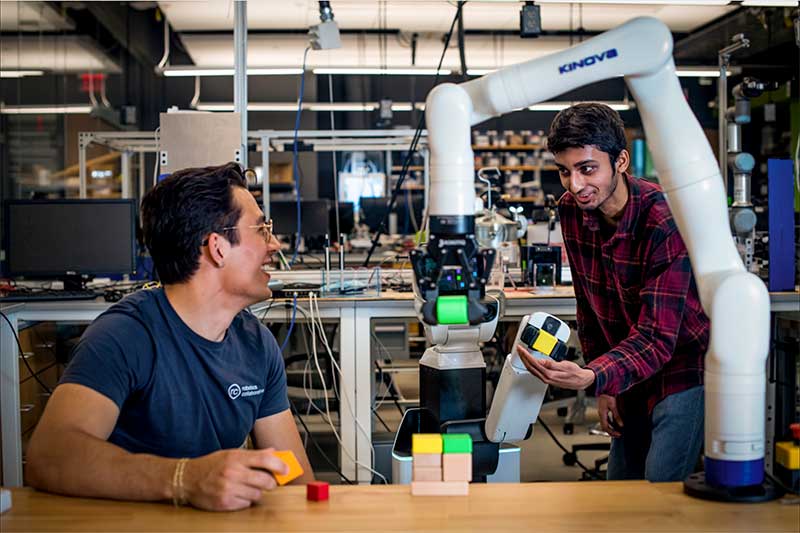 Stephen Alt (left) and Syed Mohammad Asjad in the lab at Northeastern.