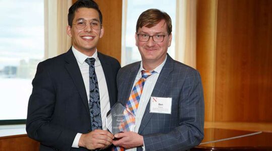 Associate Dean of Undergraduate Education and Experience Ben Hescott presents Alt with the Garnet Award in 2019. The award, part of Northeastern’s signature Compass Awards Program, recognizes a third-year undergraduate who positively impacts the school community and shows immense promise.