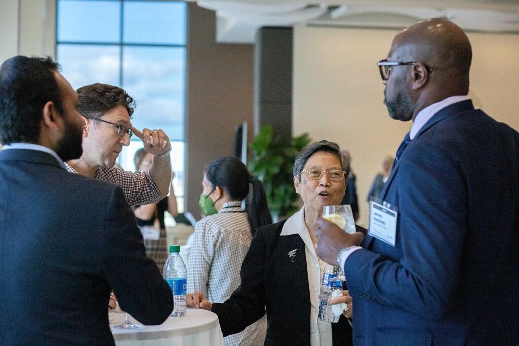 Professor emeritus Agnes Chan talks with guests.