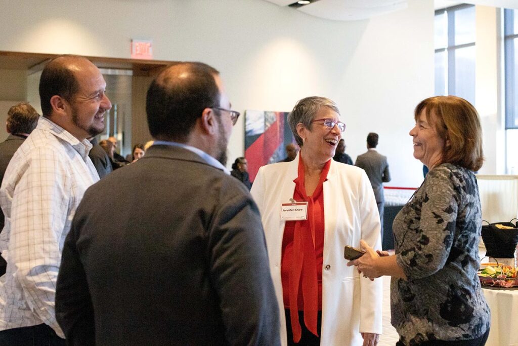 Guests chatting during reception.