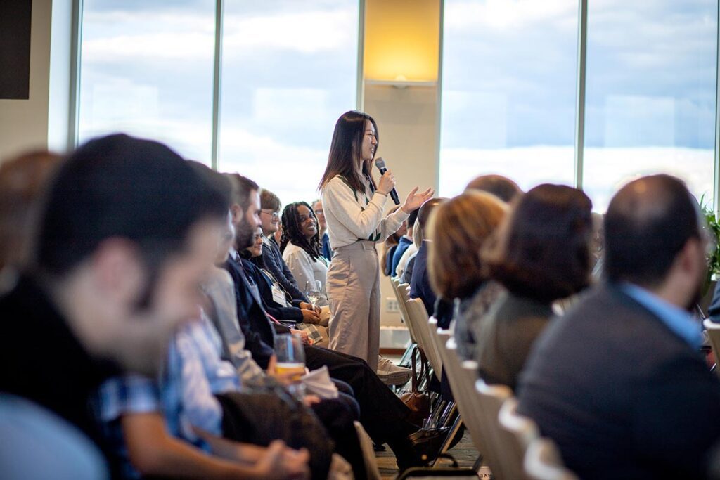 A Khoury graduate student asks a question during Q&A session with President Aoun and Dr. Khoury.