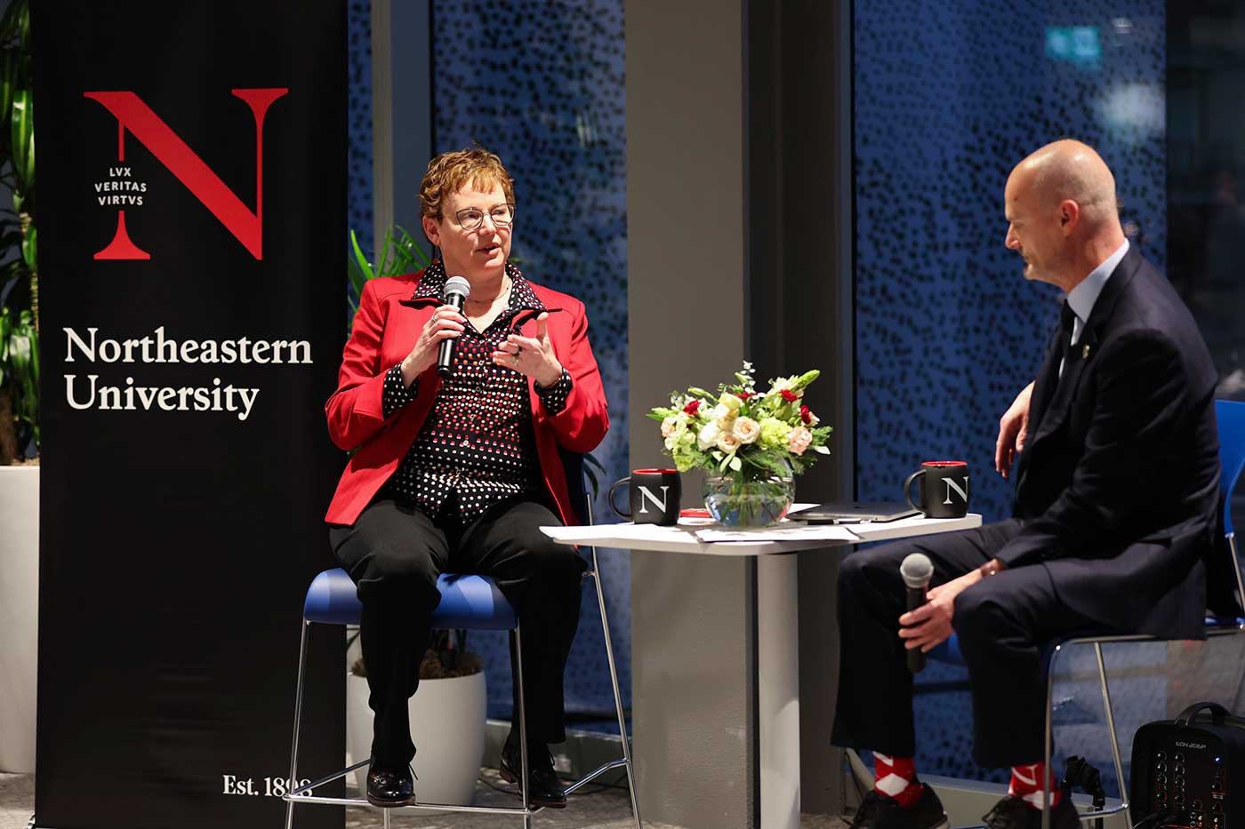 Elizabeth Mynatt asks Steve Eccles a question during the fireside chat. Photo by Jesse Winter.