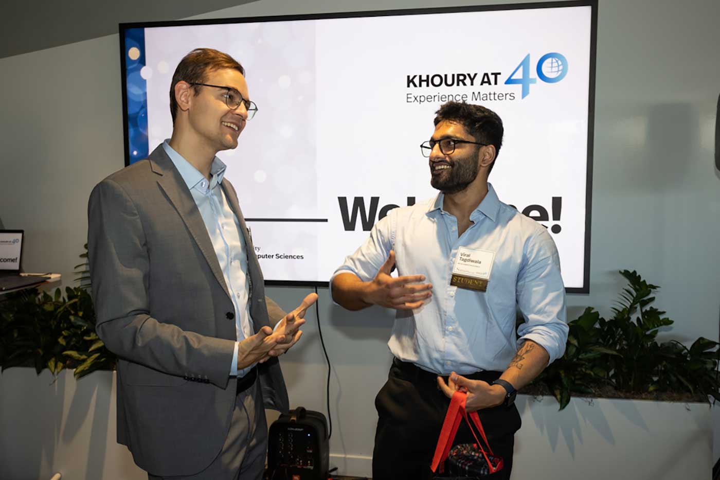 A Vancouver student speaks with visiting associate teaching professor Michal Aibin at the Vancouver 40th Anniversary Celebration.