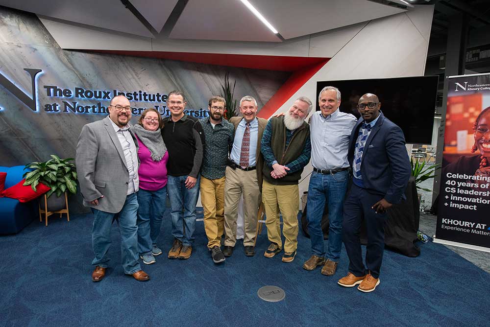 Khoury Roux Institute faculty attend the 40th Anniversary Celebration. Pictured from left to right: Alan Jamieson, Director of Computing Programs; Lindsay Jamieson, Teaching Professor; Steve Morin, Lecturer; Weston Viles, Teaching Assistant Professor; Scott Valcourt, Associate Teaching Professor; Gary Cantrell, Associate Teaching Professor; Philip Bogden, Associate Teaching Professor; Jonathan Mwaura, Associate Teaching Professor.