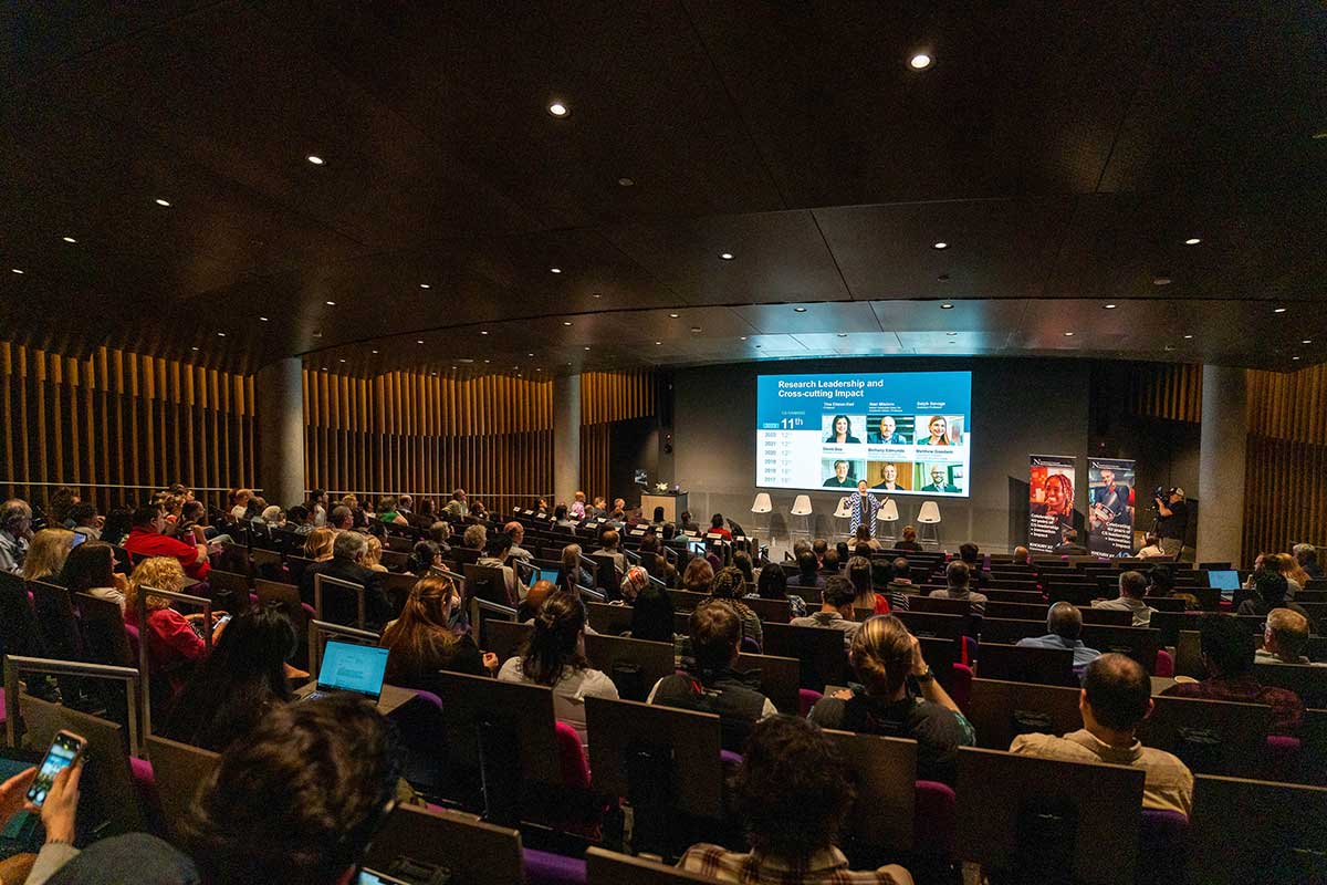 The audience watches Dean Mynatt's presentation on the future of Khoury College in the ISEC auditorium