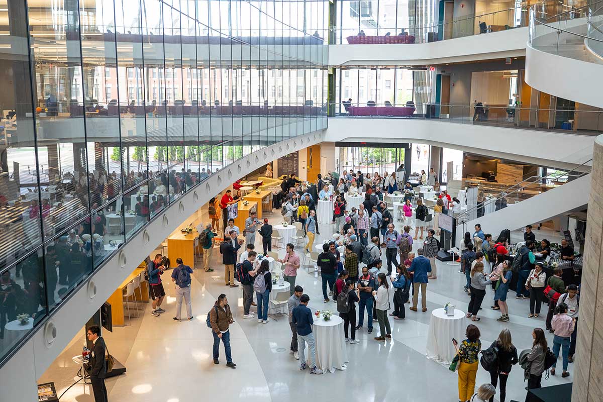 Khoury community members mingle in the ISEC atrium