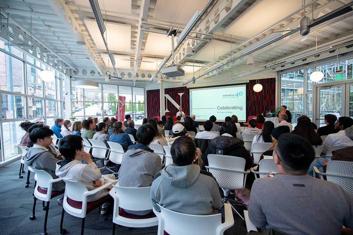 People watch a presentation about the 10-year anniversary of the Align program at the Khoury 40th anniversary celebration in Seattle.