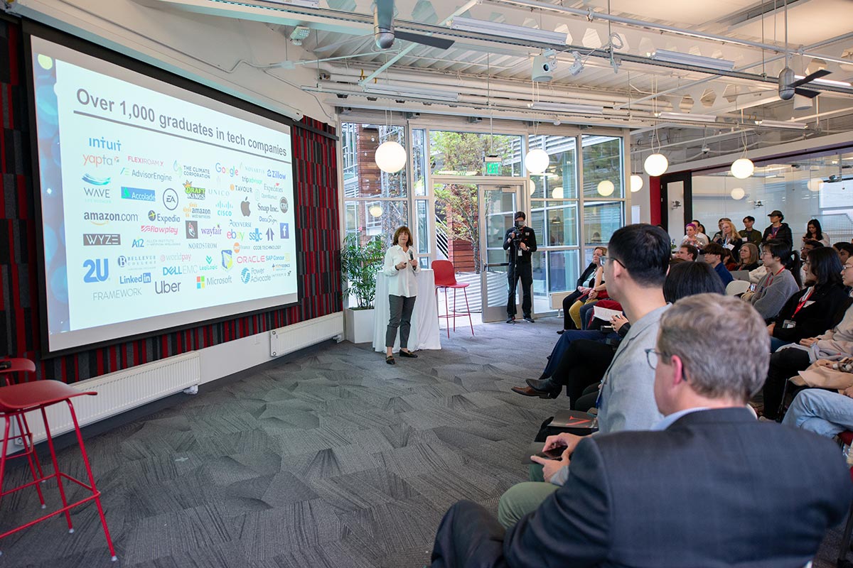 People watch a presentation about the 10-year anniversary of the Align program at the Khoury 40th anniversary celebration in Seattle.