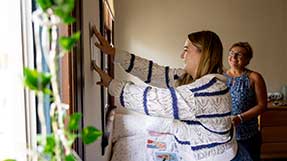 Nina Brunner, of Illinois, decorates her dorm with mother Renee Brunner. Photo by Ruby Wallau for Northeastern University