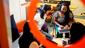 Mosaic team members work in the IDEA lab in Hayden Hall on Northeastern’s Boston campus. Photo by Matthew Modoono/Northeastern University