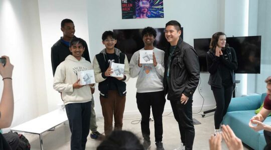 From left to right: Hackathon competitors Mihir Walvekar, Sahil Shah, and Harish Sundar, plus hackathon judge and Northeastern doctoral student Steven Yoo.