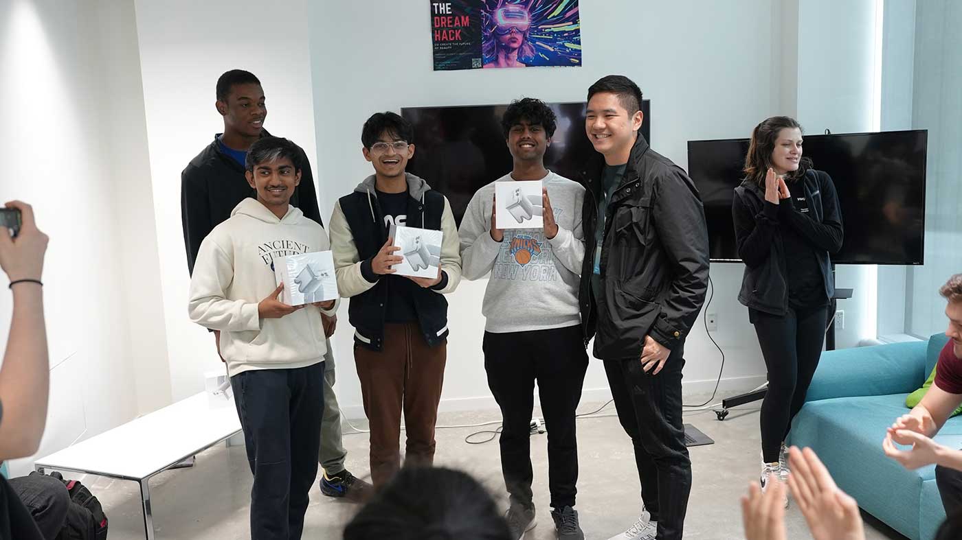 From left to right: Hackathon competitors Mihir Walvekar, Sahil Shah, and Harish Sundar, plus hackathon judge and Northeastern doctoral student Steven Yoo.