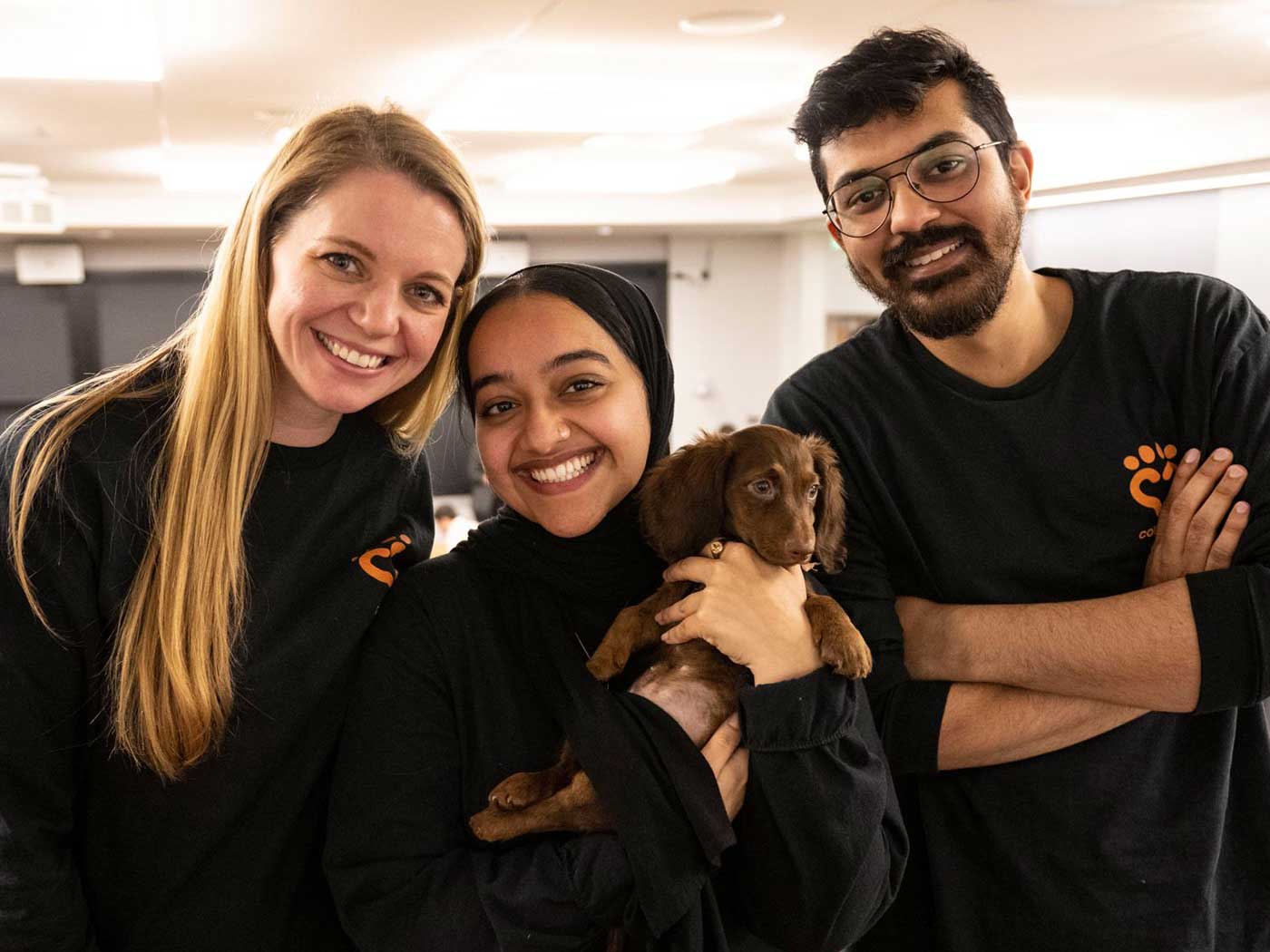 Dania Alnahdi poses with a dog.