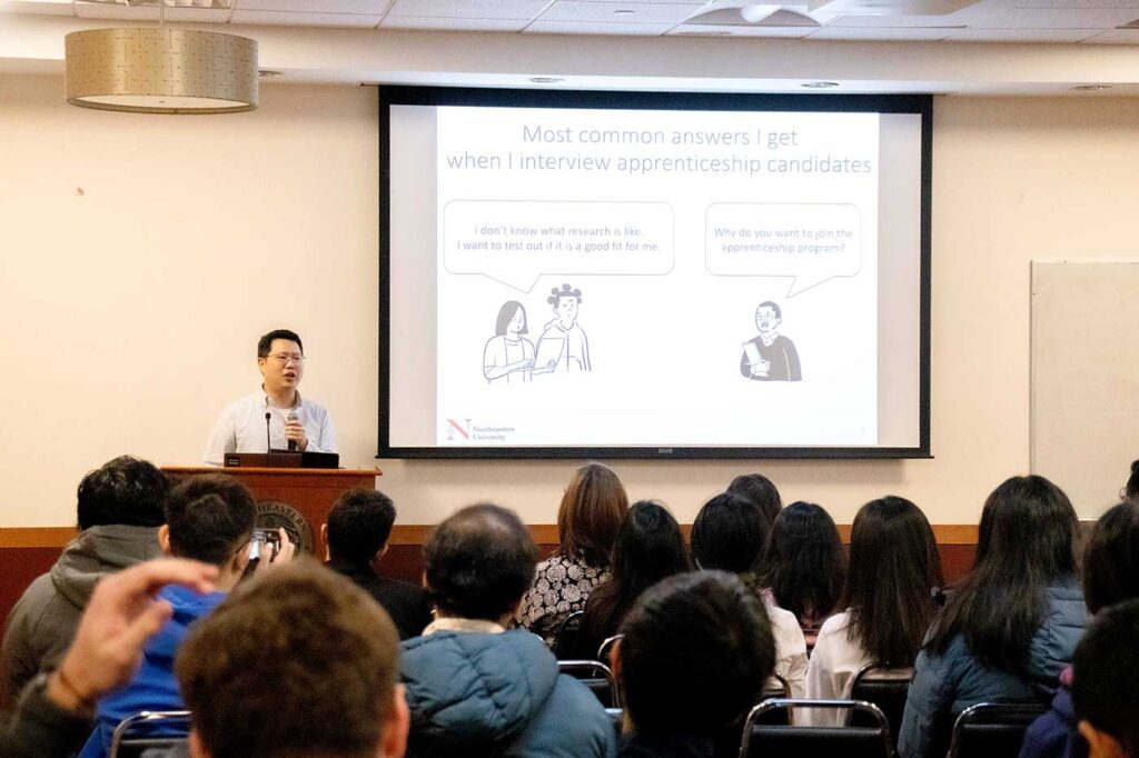 Ji-Yong Shin speaks at a podium