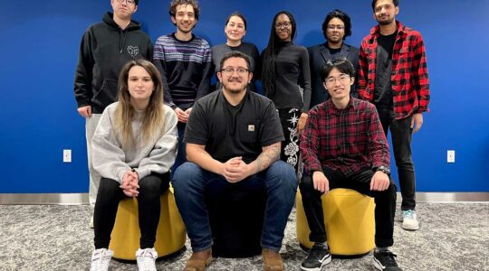 Malihe Alikhani (top, third from left) and Anthony Sicilia (bottom, center) stand with the Alexa Taskbot team