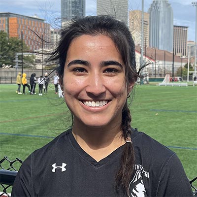 Yasmeen Dao stands on a soccer field