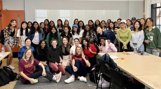 Attendees of a Northeastern Rewriting the Code event pose in a photo