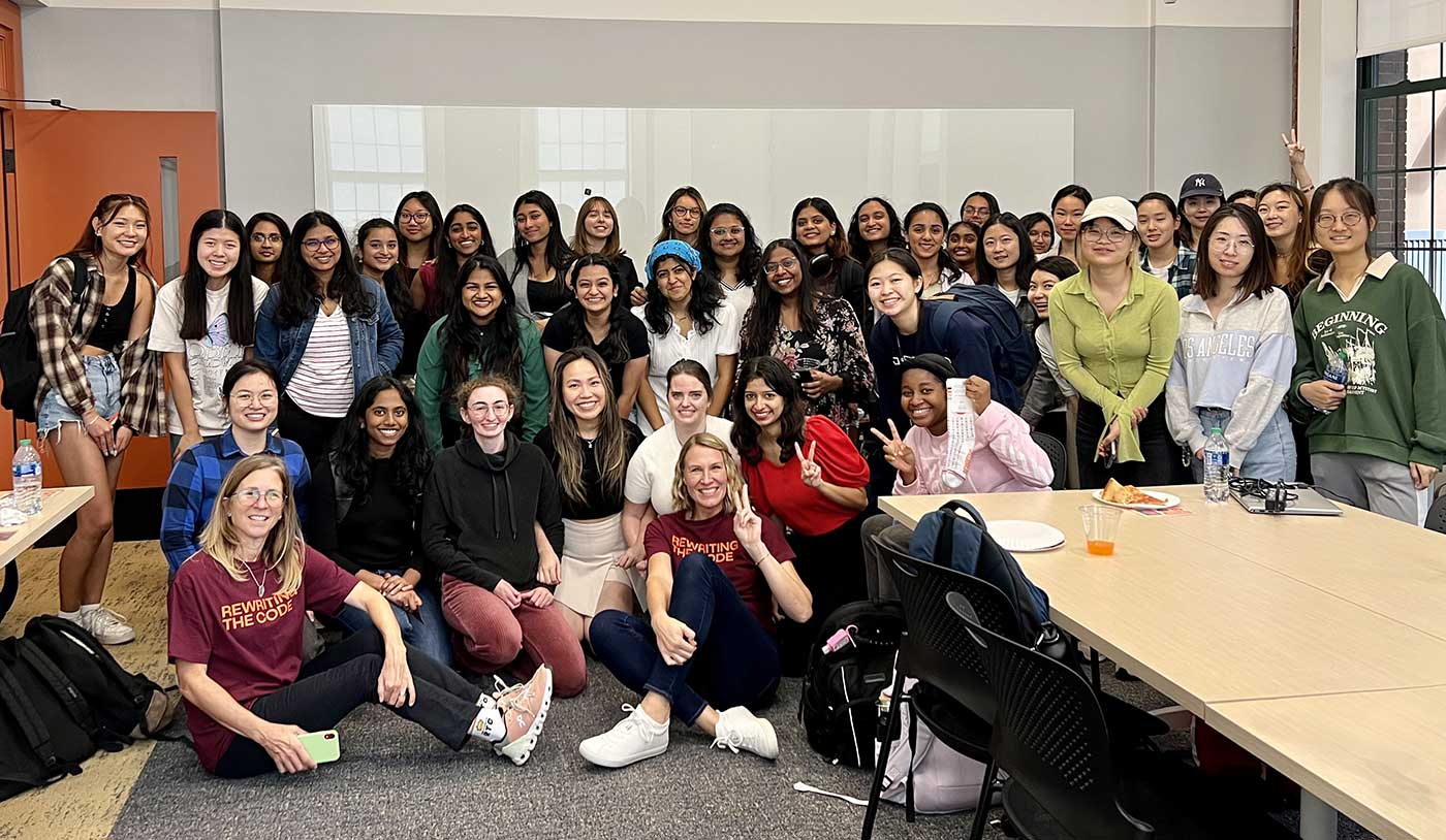 Attendees of a Northeastern Rewriting the Code event pose in a photo