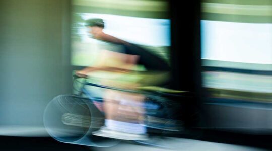 A cyclist rides a bike on Northeastern's campus. Bikes with wireless gear shifting systems are vulnerable to hacking, new Northeastern research shows. Photo by Alyssa Stone/Northeastern University