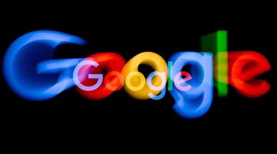 The Google logo with its letters slightly blurred on a black background