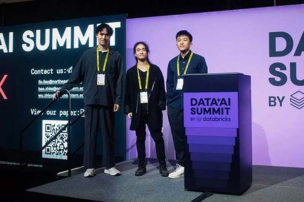 Three Northeastern Vancouver students stand on a stage at the Data AI Summit