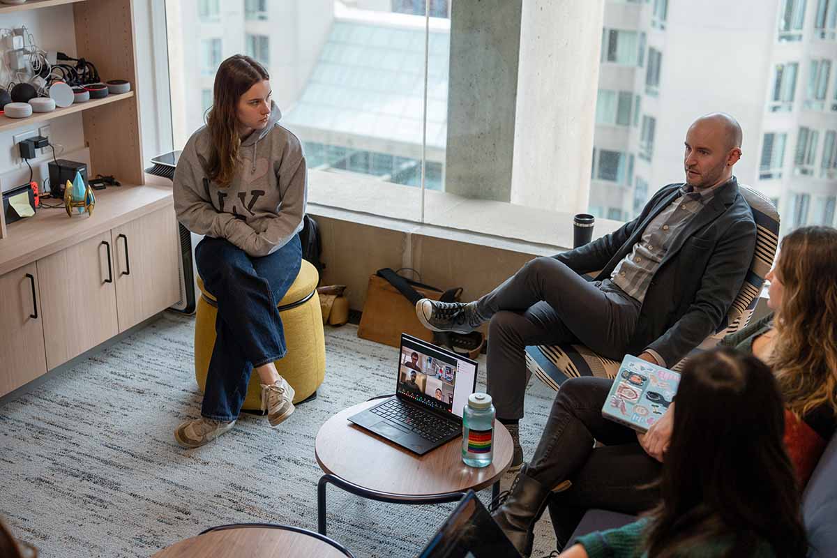 Students sitting around a professor