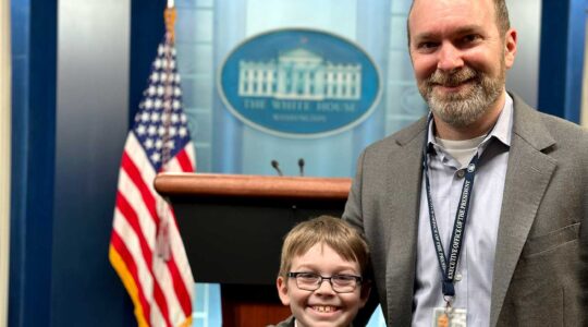 Alan Mislove and his son in the White House press briefing room