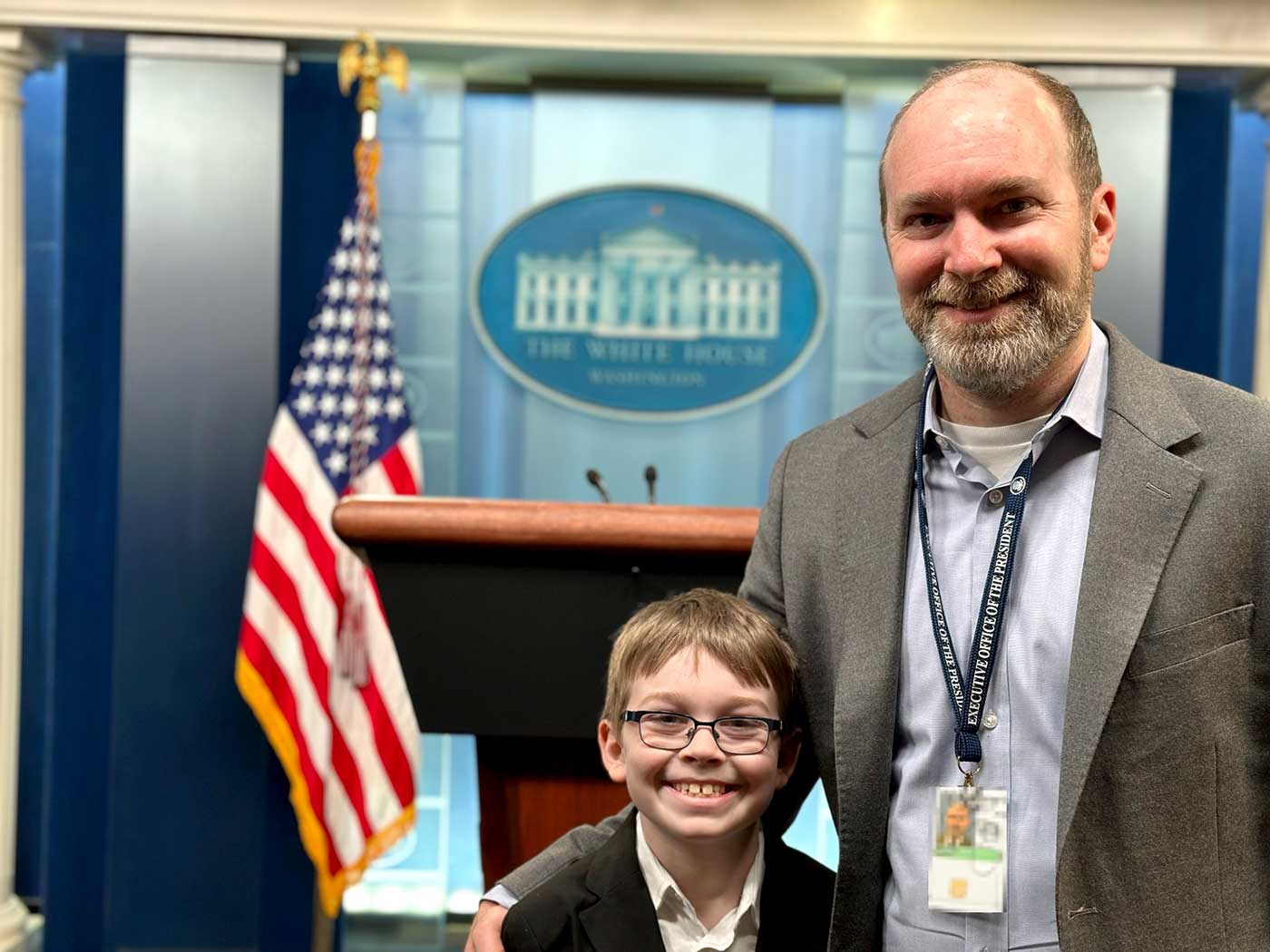 Alan Mislove and his son in the White House press briefing room