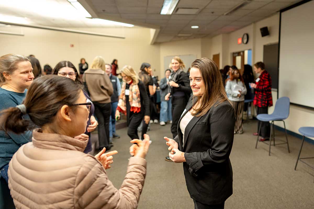 A Khoury student speaks with an industry partner during a campus event