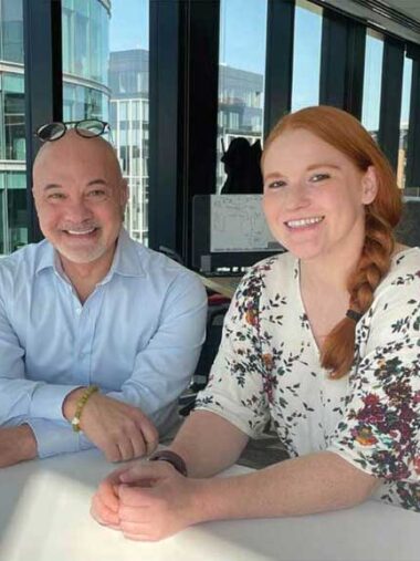 Wayne Duso (left) and Brecka Fetzer sit at a table