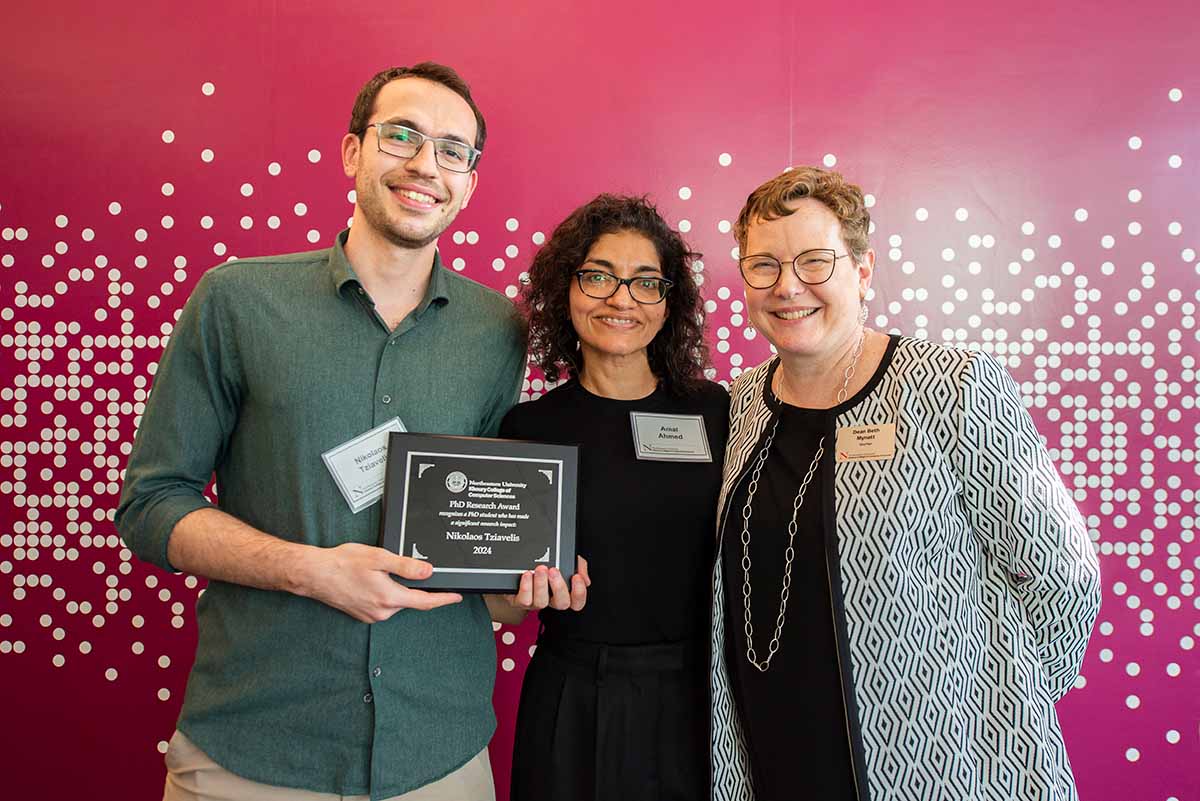 Nikolaos Tziavelis posing with a PhD Research Award with Amal Ahmed and Dean Beth Mynatt