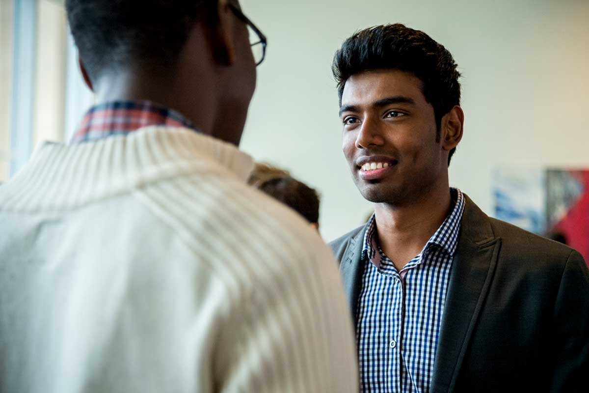 An Align student talks with another student at campus event