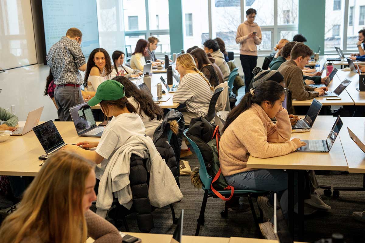 Students work on laptops in a Khoury lab