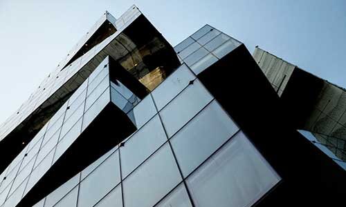 A view of the glass facade of Northeastern's building at the Vancouver campus. The Vancouver campus will gain a teaching professorship and scholarships focused on cybersecurity and diversity in a partnership with Mastercard. Photo by Matthew Modoono/Northeastern University