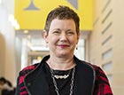 Dean Elizabeth Mynatt stands in the West Village H atrium