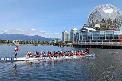 Graduate student Xin Qi was invited by Northeastern Global Learner Support specialist Joseph Clark to join the campus dragon boating team. Courtesy photo