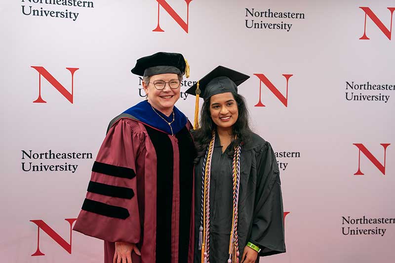 Khoury Dean Elizabeth Mynatt (left) stands with undergraduate ceremony speaker Mayukha Bhamidipati