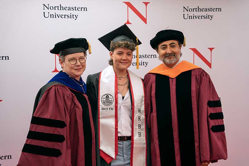 A graduate (center) poses with Khoury Dean Elizabeth Mynatt (left) and another graduate speaker