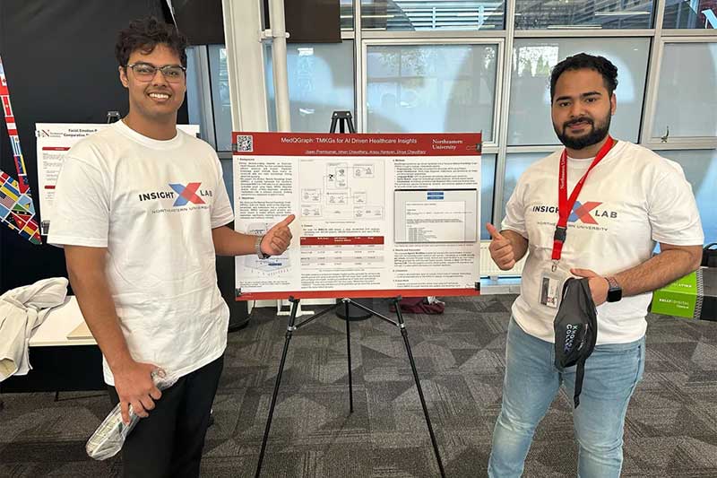 Isaac Premkumar and Ishan Chaudhary stand beside their research poster