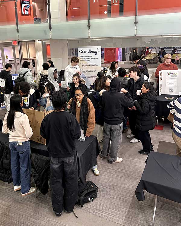 Groups of students talk during a club fair at Curry Student Center
