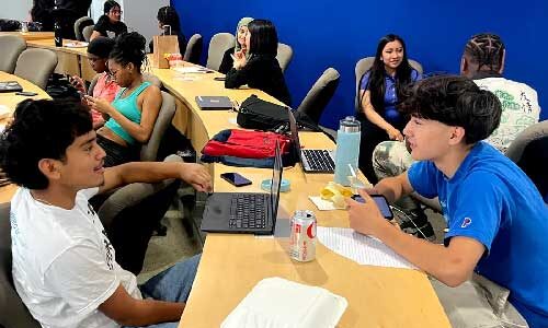 Two high school students practice interviewing during the Oakland Summer Youth Employment Program. Courtesy photo.