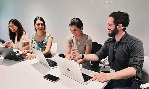 Students researched a data quality question for Traction Complete, delivering results that were “very, very helpful,” says Ernesto Valdes, chief technology officer (right). Courtesy photo