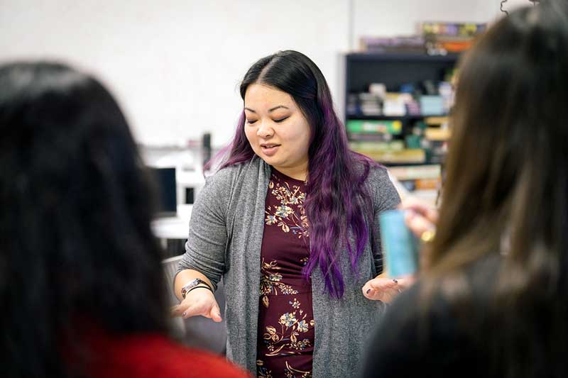 Alexandra To talks to a group of students in a lab