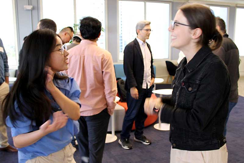 Two Khoury Silicon Valley students talk at a research showcase